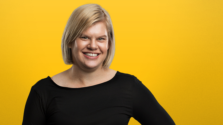 Women with a lovely smile with a yellow background.