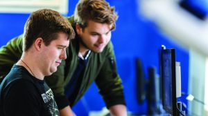 2 Men looking at the computer