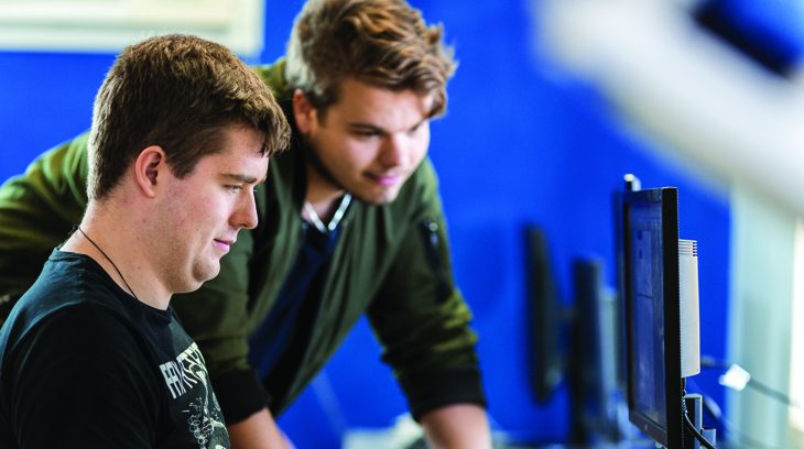 2 Men looking at the computer