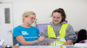 2 girls looking happy at work