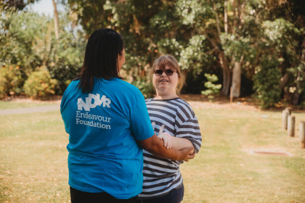 2 lady holding each other
