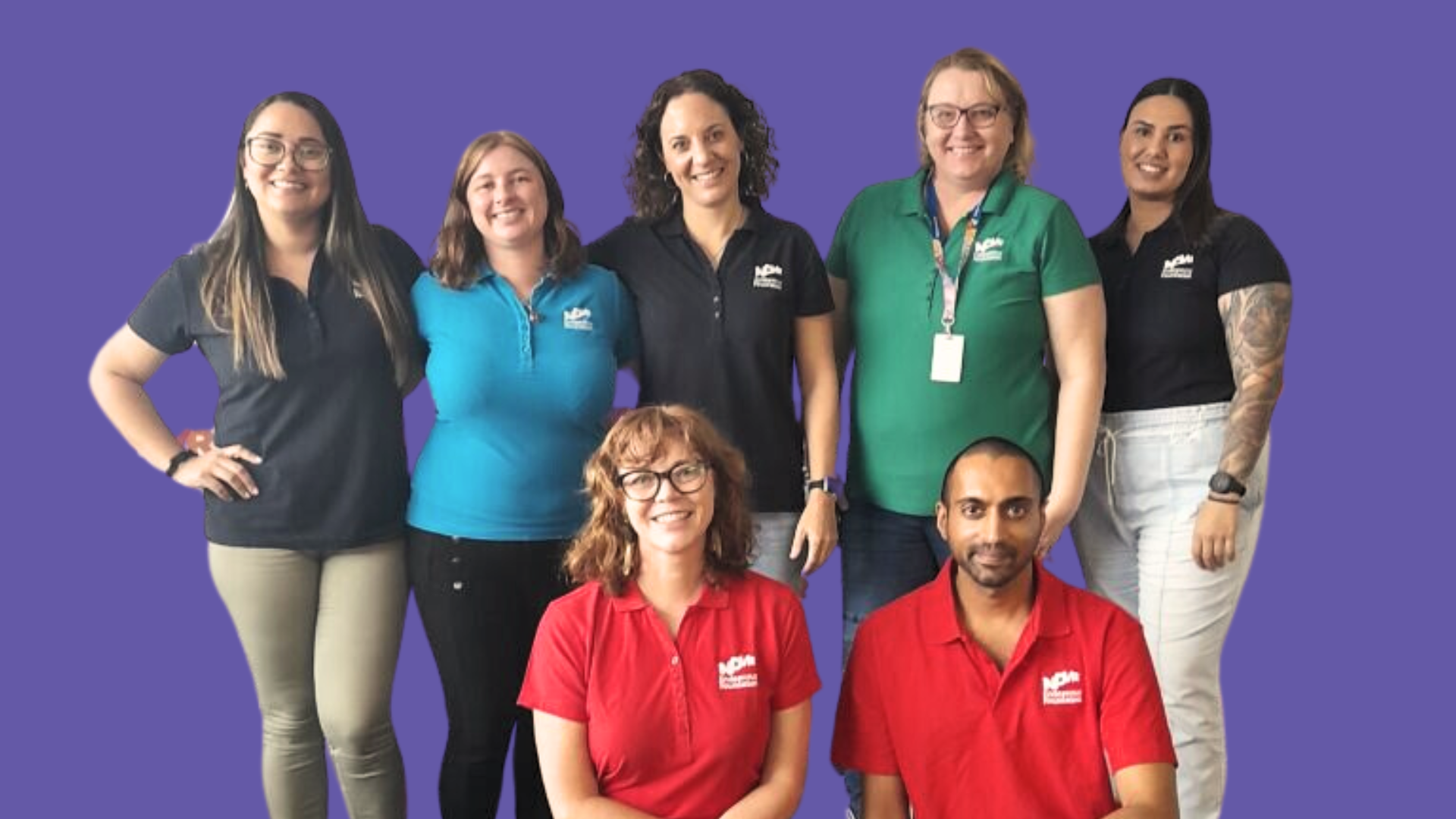 7 people smiling at the camera.
