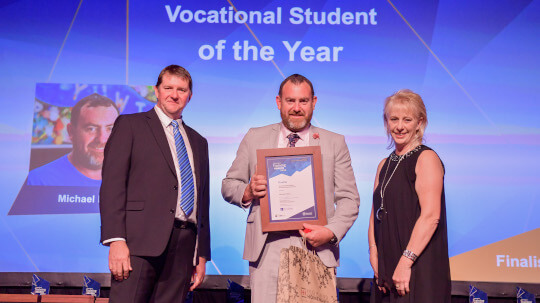 Michael receiving award