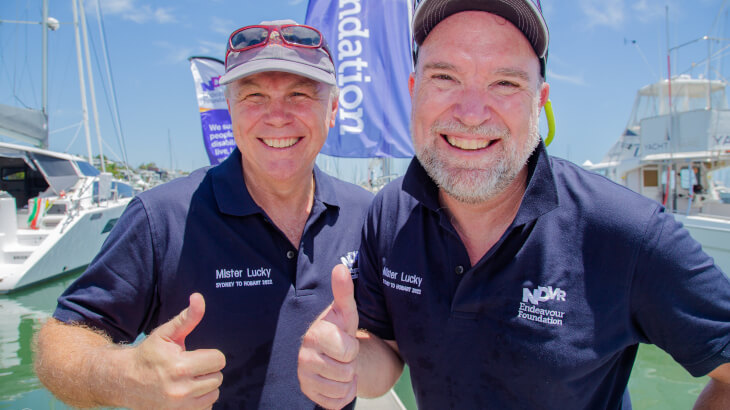 2 men smiling on boat