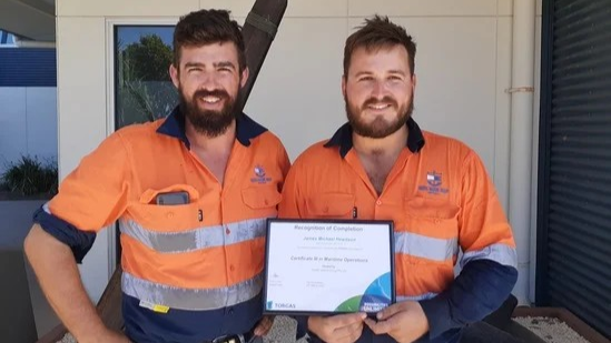 2 Men are happy to receive their certificate.