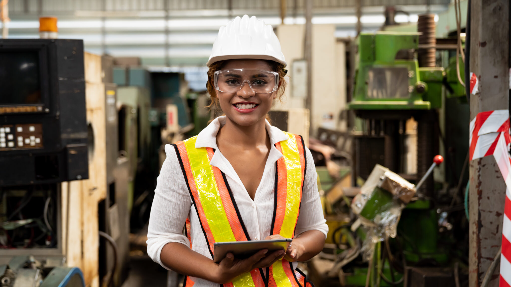Women dressed to do some machine work.